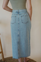 Load image into Gallery viewer, detail view of model wearing the as long as I live denim midi skirt. model has the skirt paired with the used to know bodysuit in the color light moss.