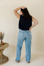 Load image into Gallery viewer, back view of model wearing the in season sweater tank. model has the sweater paired with a pair of medium wash denim.
