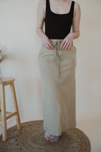 Load image into Gallery viewer, detail view of model wearing the in another life skirt. model has the skirt paired with the used to know bodysuit in the color black.