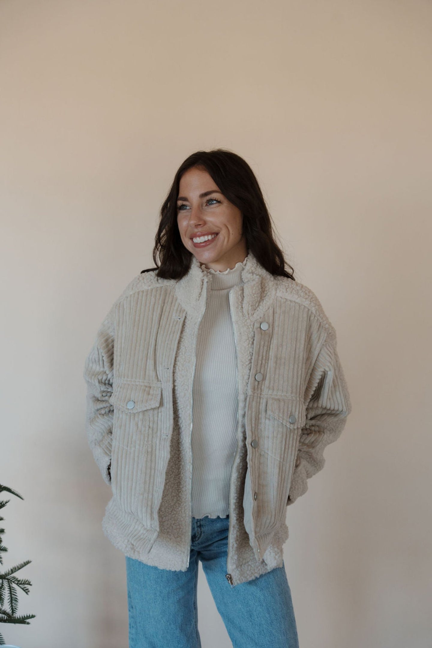 front view of model wearing the these are the days jacket. model has the jacket paired with the until you top in the color cream.