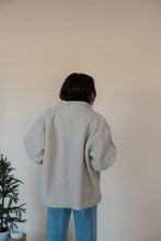 Load image into Gallery viewer, back view of model wearing the these are the days jacket. model has the jacket paired with the until you top in the color cream.