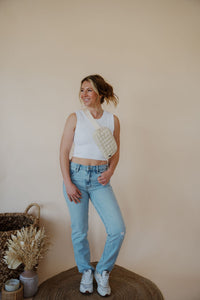 front view of model wearing the charleston denim. model has the denim paired with the forever yours top in the color white.
