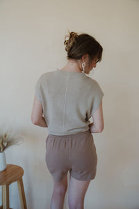 back view of model wearing the used to be set in the color taupe/mocha.