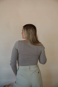 back view of model wearing the better days top. model has the top paired with the oakland chinos.