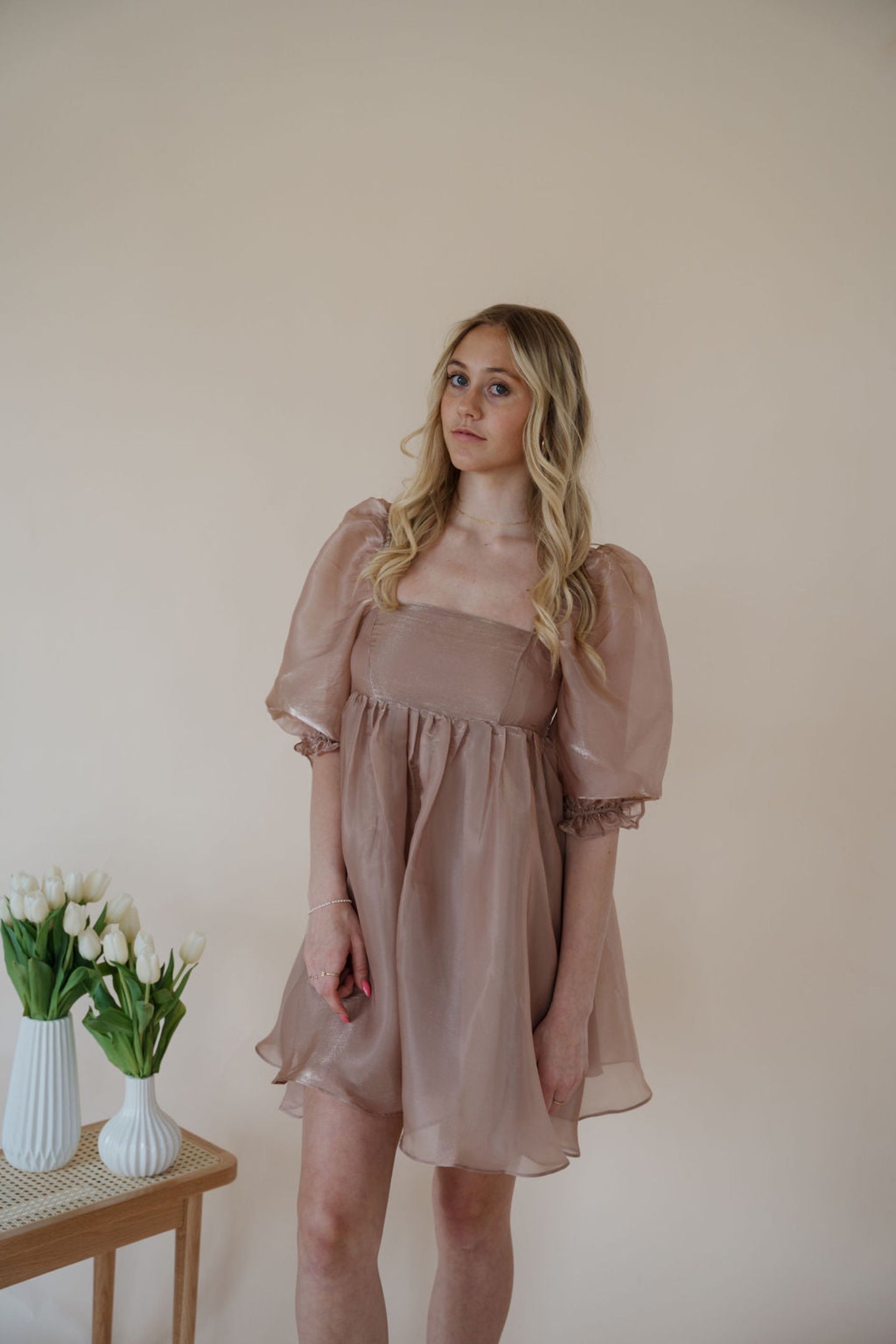 front view of model wearing the wherever you go dress. model has the dress paired with the dainty mallory necklace.