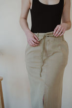 Load image into Gallery viewer, detail view of model wearing the in another life skirt. model has the skirt paired with the used to know bodysuit in the color black.