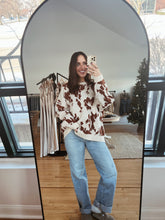 Load image into Gallery viewer, model wearing the out west sweater paired with the Jackson denim