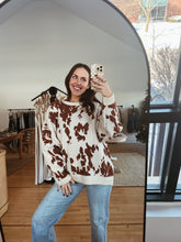 Load image into Gallery viewer, model wearing the out west sweater paired with the Jackson denim