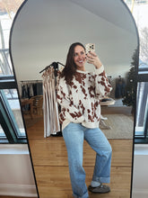 Load image into Gallery viewer, model wearing the out west sweater paired with the Jackson denim
