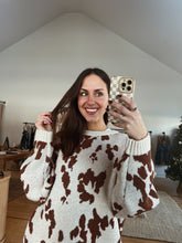 Load image into Gallery viewer, model wearing the out west sweater paired with the Jackson denim