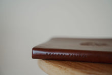 Load image into Gallery viewer, side binding view of the hosanna revival lined notebook in the Santa Elena theme.