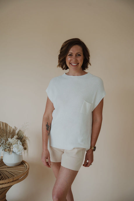 front view of model wearing the used to be set in the color cream/shell.