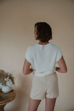 Load image into Gallery viewer, back view of model wearing the used to be set in the color cream/shell.