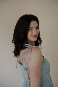 detail view of model wearing the starting over dress