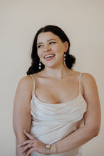 Load image into Gallery viewer, close up front view of model wearing the wherever I&#39;m with you maxi. model has the dress paired with the MK necklace and the magnolia earrings.