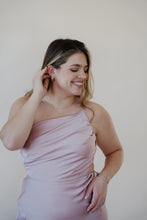 Load image into Gallery viewer, close up front view of model wearing the sweet romance midi dress. model is also wearing the croissant hoops and the Anna necklace.