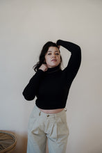 Load image into Gallery viewer, front view of model wearing the after all top in the color black. model has the top paired with the Oakland chinos.