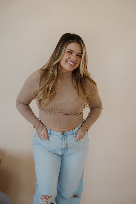 front view of model wearing the after all top in the color almond. model has the top paired with the Camden denim.
