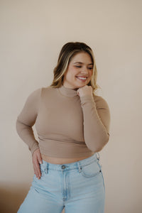 front view of model wearing the after all top in the color almond. model has the top paired with the Camden denim.