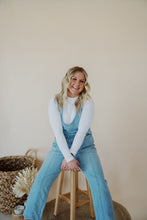 Load image into Gallery viewer, front view of model wearing the clara denim jumpsuit in denim.