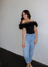 Load image into Gallery viewer, model wearing the crazy in love bodysuit in the color black. model has the top paired with a pair of light wash denim.