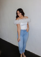Load image into Gallery viewer, model wearing the crazy in love bodysuit in the color white. model has the top paired with a pair of light wash denim.