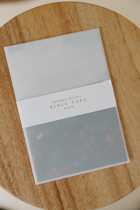 Bible tabs packaging on a wooden surface