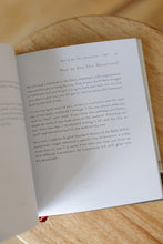 Load image into Gallery viewer, inside page photo of &quot;yet: the promise in Habakkuk for those in transition&quot; by Erica Borden. book is shown sitting on a wooden stool.
