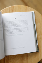 Load image into Gallery viewer, inside page photo of &quot;yet: the promise in Habakkuk for those in transition&quot; by Erica Borden. book is shown sitting on a wooden stool.