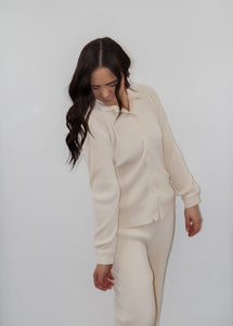 model wearing the aspen top + aspen pants in the color cream.