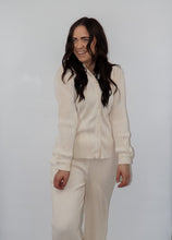 Load image into Gallery viewer, model wearing the aspen top + aspen pants in the color cream.