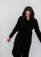 Load image into Gallery viewer, model wearing the aspen top + aspen pants in the color black.