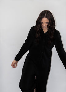 model wearing the aspen top + aspen pants in the color black.
