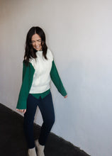 Load image into Gallery viewer, model wearing the all my days sweater vest paired with the take me away top in the color deep green. model has the tops paired with the siena denim.