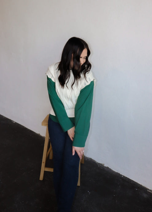 model wearing the all my days sweater vest paired with the take me away top in the color deep green. model has the tops paired with the siena denim.